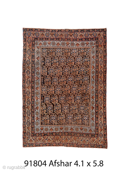 Antique Persian Afshar Rug, Circa 1900. Finely drawn allover pattern of stylized cypress trees and geometric floral motifs in warm camel, walnut, and soft blue tones.

4'1" x 5'8"

Item No: 91804   