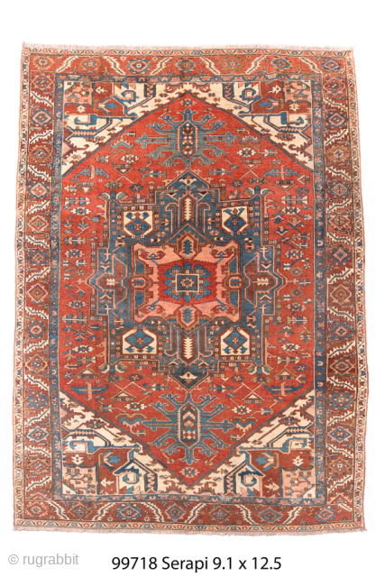 Antique Persian Serapi Carpet, Circa 1900. Striking stepped brick-red medallion surrounded by ivory and deep blue geometric motifs in the bold tribal style of the Heriz region.

9'1" x 12'5"

Item No: 99718  
