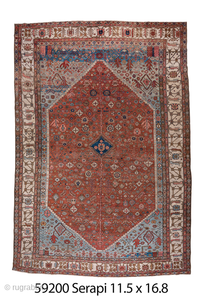 Antique Persian Serapi Carpet, Circa 1900. Rare, spacious design with a large terracotta lozenge medallion set against an ivory field accented by soft sky-blue spandrels.
11'5" x 16'8"
Item No: 59200
