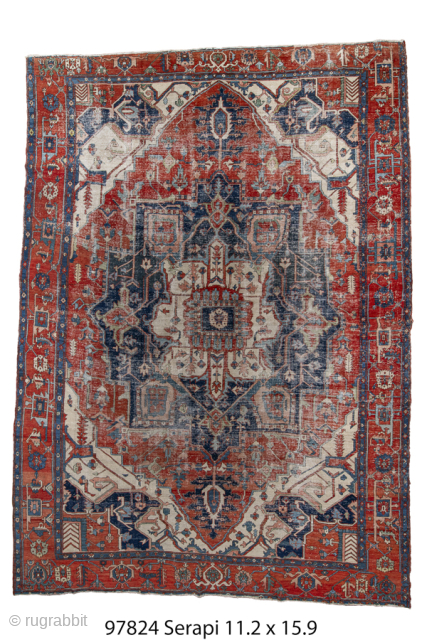 Antique Persian Serapi Carpet, Circa 1900. Dramatic stepped medallion set within a richly abrashed terracotta and indigo field framed by bold ivory spandrels and a geometric border.
11'2" x 15'9"
Item No: 97824