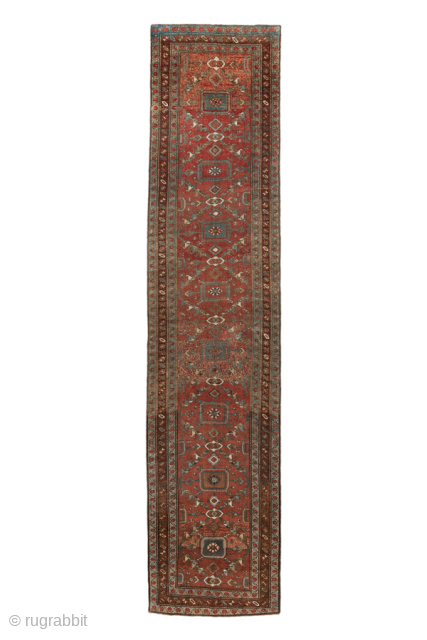 Antique Persian Bidjar Runner, Circa 1920. Rhythmic series of geometric medallions woven across a warm terracotta field enclosed by finely detailed multiple borders.
3'6" x 14'10"
Item No: 100042