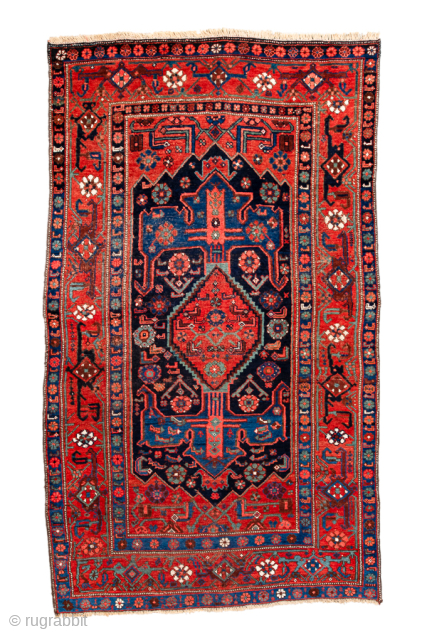 Antique Persian Bidjar Runner, Circa 1920. Bold geometric medallion design on a deep navy field framed by a vibrant crimson border with striking tribal motifs.
4'1" x 7'0"
Item No: 101222