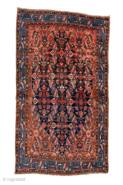 Antique Persian Bidjar Rug, Circa 1920. Elegant allover Herati design woven across a deep navy field, framed by warm camel spandrels and a vibrant sky-blue turtle border.
4'6" x 7'9"
Item No: 101378