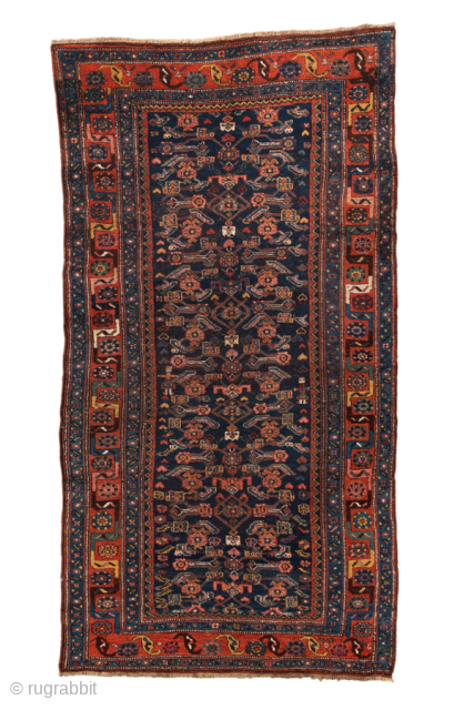 Antique Persian Bidjar Runner, Circa 1920. Finely detailed allover geometric floral design woven across a deep midnight blue field framed by richly ornamented crimson borders.
4'6" x 8'6"
Item No: 98965