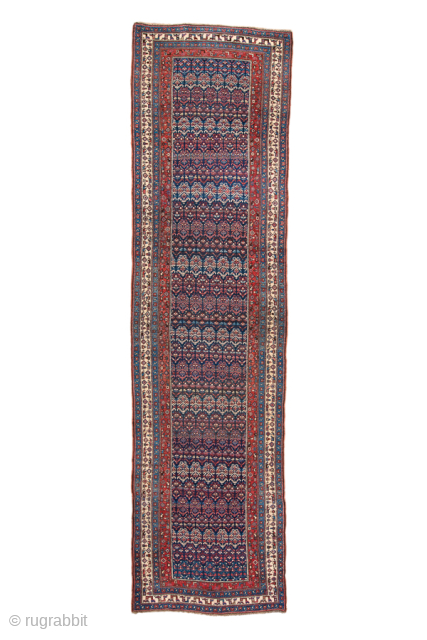 Antique Persian Bidjar Runner, Circa 1920. Finely woven allover Herati pattern set against a deep indigo field framed by crisp ivory and crimson floral borders.
3'7" x 13'9"
Item No: 99096