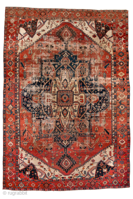 Antique Persian Serapi Carpet, Circa 1900. Features a commanding cruciform medallion set within a richly abrashed terracotta field framed by ivory spandrels and a bold geometric border.
12'8" x 18'10"
Item No: 99818
