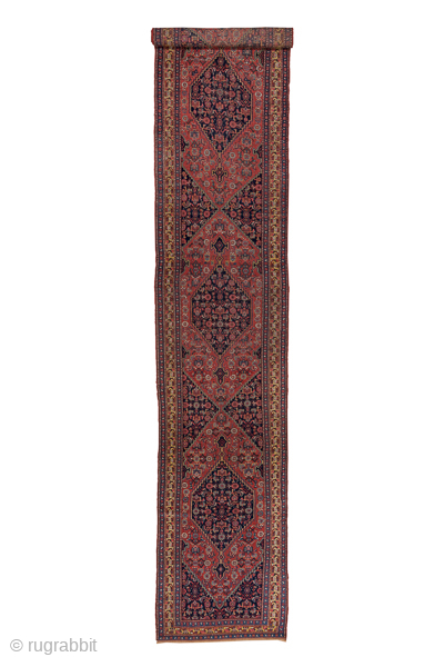 Antique Persian Bidjar Runner, Circa 1910. Dramatic series of diamond medallions filled with intricate Herati motifs woven across a rich terracotta field framed by finely detailed floral borders.
3'11" x 20'5"
Item No: C6186
