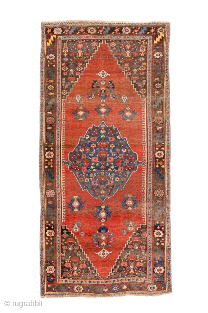 Antique Persian Bidjar Rug, Circa 1900. Bold indigo diamond medallion set against a warm salmon-red field adorned with stylized floral and geometric motifs.
4'8" x 9'7"
Item No: 99453