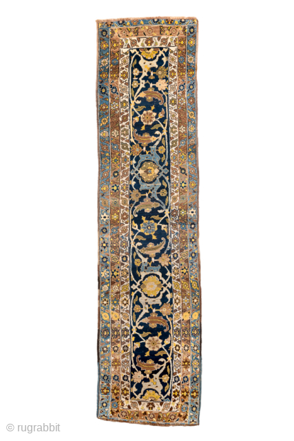 Antique Persian Bidjar Runner, Circa 1900. Rare scrolling floral vine design woven across a rich midnight blue field and framed by multiple delicately ornamented ivory and sky-blue borders.
3'8" x 14'5"
Item No: 99859