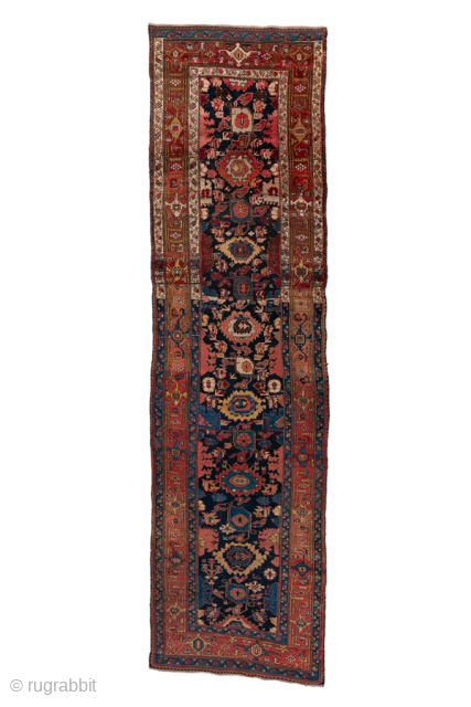 Antique Persian Bidjar Runner, Circa 1910. Elegant vertical arrangement of stylized palmettes and Herati-inspired floral motifs woven across a rich midnight blue field framed by finely detailed terracotta borders.
3'7" x 13'0"
Item No: ...