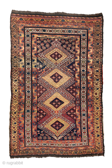 Antique Persian Kurdish Rug, Circa 1900. Four dramatic hooked diamond medallions woven across a deep midnight blue field framed by richly detailed geometric tribal borders.
4'3" x 6'7"
Item No: 100347