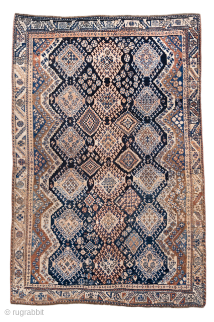 Antique Persian Kurdish Rug, Circa 1900. Striking allover lattice of stepped diamond medallions woven across alternating midnight blue and ivory geometric bands framed by an elegant ivory tribal border.
4'7" x 7'0"
Item No: ...