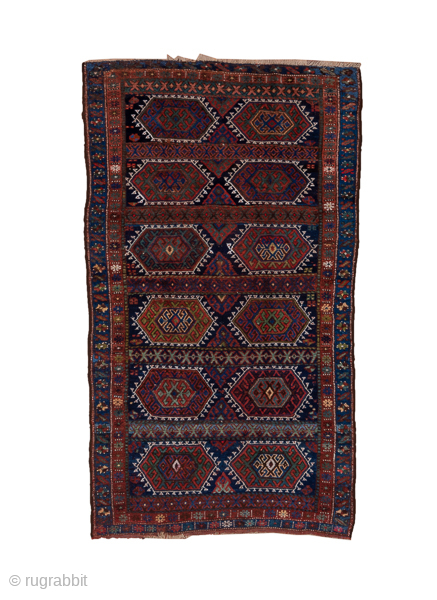 Antique Persian Kurdish Rug, Circa 1900. Allover arrangement of octagonal tribal guls woven across a rich midnight blue field framed by bold geometric borders.
4'1" x 7'2"
Item No: C68626