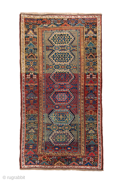Antique Persian Kurdish Rug, Circa 1900. Geometric medallions aligned along a deep midnight blue field framed by richly ornamented tribal side panels and elegant ivory borders.
4'1" x 7'9"
Item No: 98961