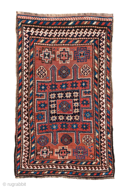 Antique Persian Kurdish Rug, Circa 1900. Striking geometric compartment design centered on a stepped cruciform motif framed by bold barber-pole and ivory tribal borders.
4'0" x 6'6"
Item No: 99568