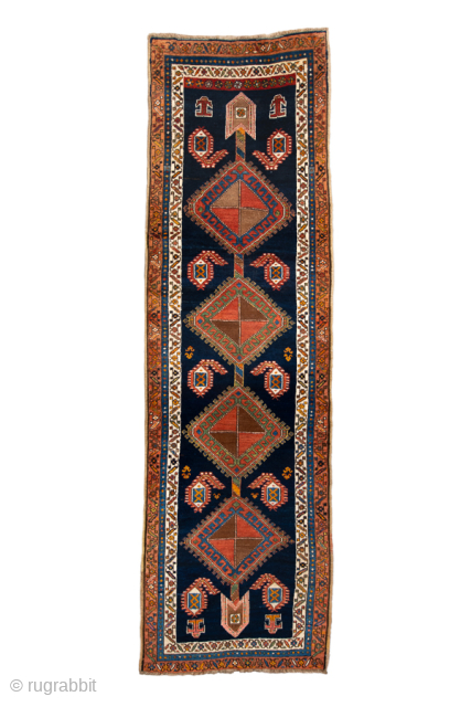 Antique Persian Kurdish Runner, Circa 1900. Bold diamond medallions set against a striking deep-indigo field.

3'4" x 11'4"

Item No: 100979              