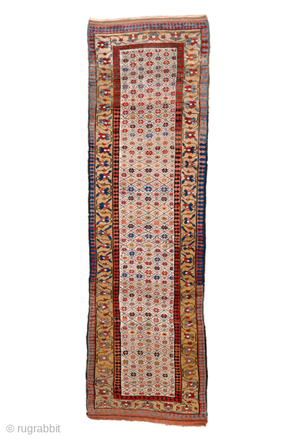 Antique Persian Kurdish Runner, Circa 1900. Delicate diamond lattice design across an unusually light ivory field.
3'7" x 12'5"
Item No: 101453