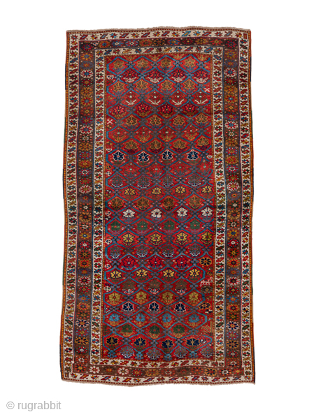 Antique Persian Kurdish Rug, Circa 1900. Finely woven allover lattice of hooked diamond medallions across a vibrant madder-red field framed by elegant ivory and geometric tribal borders.
4'8" x 8'8"
Item No: 41320