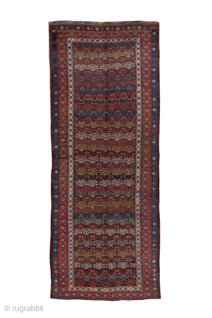 Antique Persian Kurdish Gallery Rug, Circa 1900. Rows of small stylized floral motifs across a richly patterned dark field.
5'2" x 12'9"
Item No: C55144