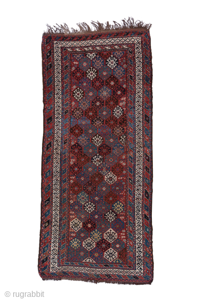 Antique Persian Kurdish Rug, Circa 1900. Finely detailed allover lattice of octagonal tribal motifs woven across a rich midnight blue field framed by crisp ivory geometric borders.
4'0" x 8'7"
Item No: C68492