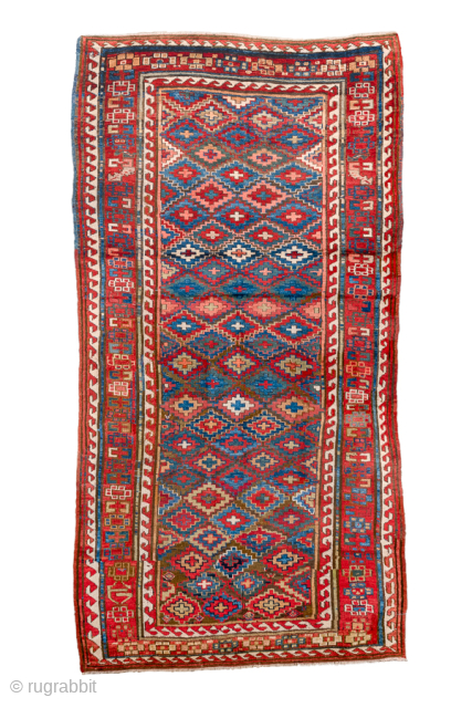 Antique Persian Kurdish Rug, Circa 1900. Vibrant allover lattice of hooked diamond motifs woven across a luminous sky-blue field framed by bold madder-red tribal borders.
4'3" x 8'4"
Item No: 85595