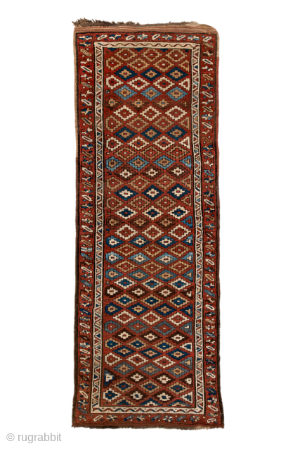 Antique Persian Kurdish Rug Runner, Circa 1900. Finely detailed allover lattice of hooked diamond motifs woven across a warm madder-red field framed by crisp ivory and geometric tribal borders.

3'4" x 9'0"

Item No:  ...