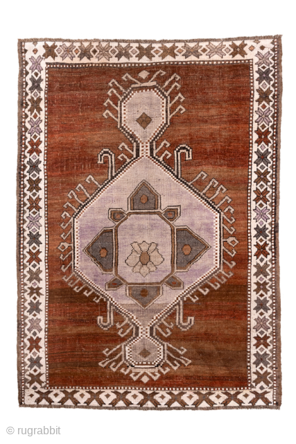 Antique Turkish Kars Rug with Central Medallion, Circa 1920. Features a bold geometric medallion set against a warm rust-brown field.
4'10" x 6'9"
Item No: 101997