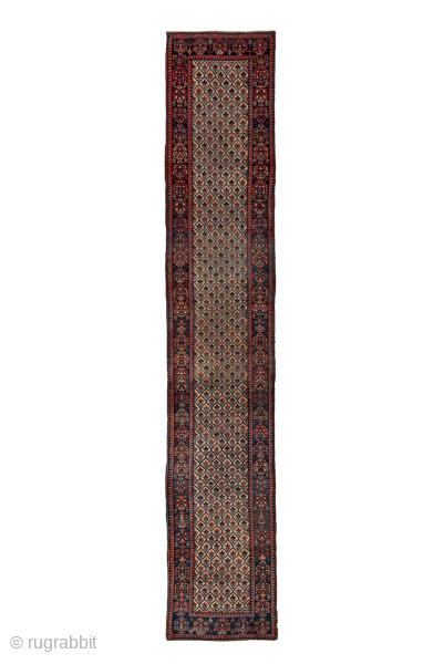 Antique Persian Kurdish Runner with Diamond Lattice Design, Circa 1900. Features a finely patterned diamond lattice across a muted field framed by deep indigo and madder-red borders.
3'1" x 16'10"
Item No: 56644