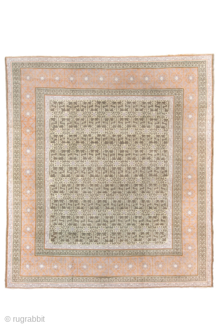 This elegant antique Oushak rug showcases a beautifully detailed allover lattice design in soft sage green and ivory, framed by a wide border in warm peach and golden tones. Its geometric patterning  ...