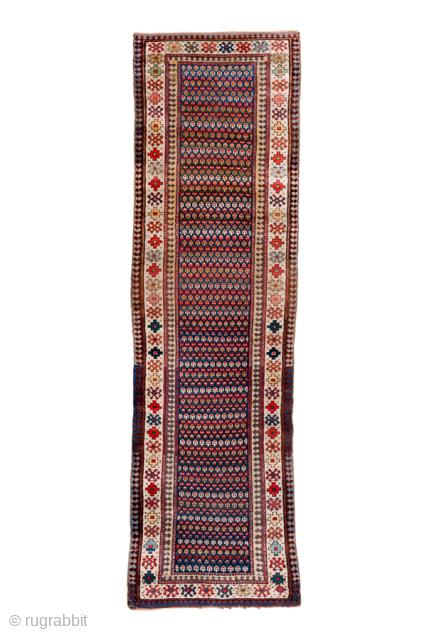 Antique Persian Malayer Runner with Repeating Geometric Motifs, Circa 1920. Features a finely patterned dark field of repeating geometric motifs framed by an ivory floral and geometric border.
Inventory no. 101338
2'10" x ...