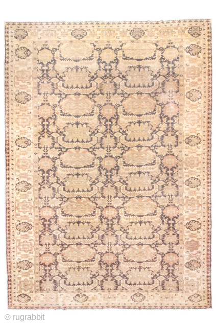 This magnificent antique Oushak rug showcases a highly decorative repeating lattice motif, executed in a refined palette of soft taupe, ivory, muted rose, and charcoal accents. The allover design conveys symmetry and  ...