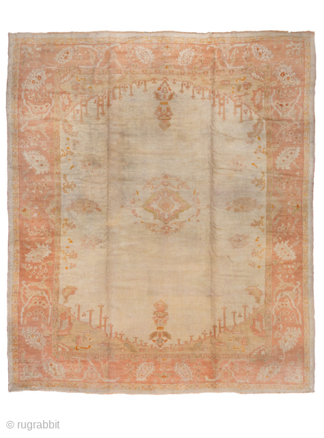 This magnificent antique Oushak rug, woven circa 1900, showcases the timeless elegance for which Oushak weaving is celebrated. The expansive 13 × 15 ft scale makes it a commanding centerpiece, perfect for  ...
