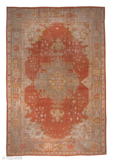 This grand-scale antique Oushak rug from Western Turkey showcases the effortless elegance and luminous color palette for which Oushaks are celebrated. The spacious field features a striking medallion rendered in shades of  ...