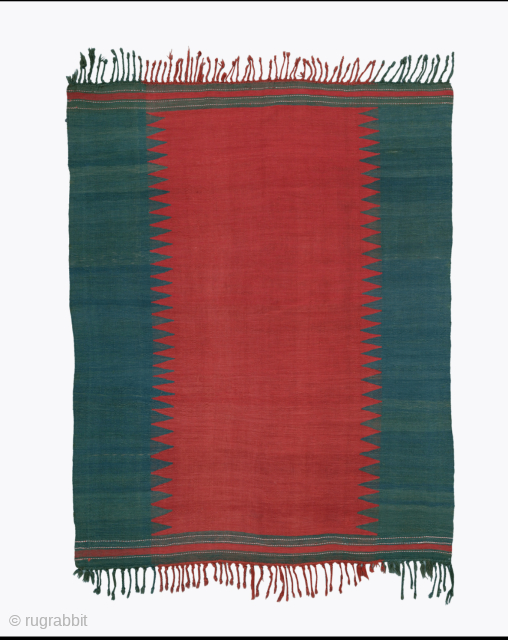 Second Half 19th Century Azeri Sofreh

Woven in a single panel, this kilim cover is executed in just two colours. The empty red field and the equally undecorated green vertical borders are interlocked  ...
