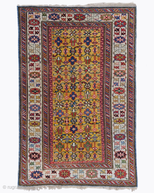 Period: Mid 19th Century
Origin: Shirvan
Dimensions: 106 x 163 cm

This rare mid 19th century Kuba Shirvan rug highlights a powerful and rhythmic geometric composition featuring a vertical sequence of three monumental star filled  ...