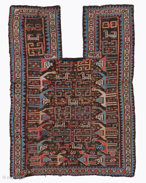 Period: Late 19th Century
Origin: Caucasus
Dimensions: 80 x 106 cm

This rare late 19th century Caucasian horse cover highlights a powerful and rhythmic geometric composition featuring a dense array of stylized zoomorphic figures and  ...