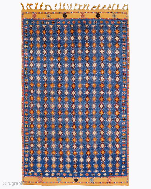 Period: Late 19th Century
Origin: Morocco
Dimensions: 155 x 245 cm
This rare late 19th century Moroccan carpet highlights a powerful and rhythmic composition featuring an endless, dynamic all-over grid of repeating geometric diamond lattice ...