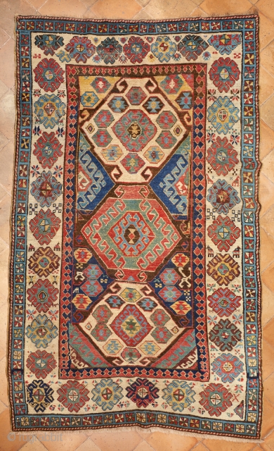 Antique Talish from South Caucasus. Beautiful and rare "kilim" design with multicolor hooked medallions with ram’s horns and Mother Goddess figures. Classic main border on white ground with big palmettes, eight pointed  ...