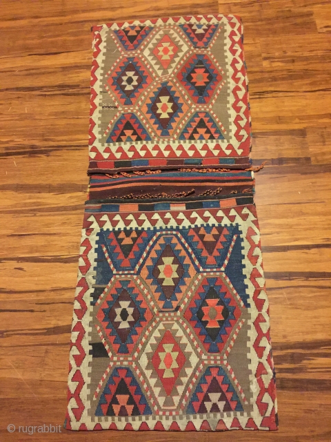 Antique kilim khorjin, Kurds of Varamin.. 52” X 21”. Circa 1900. All natural dyes. Complete and in excellent original untouched condition.            