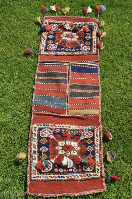 Exceptional West Anatolian pile heybe (Kilaz). 3 ft. 9 in. X 1 ft. 3 in. Circa 1900, possibly earlier. Wool. Brilliant natural dyes. Original condition with tassels intact. Probably a dowry piece.  ...