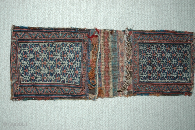 Shahsavan chanteh khorjin third quarter of 19th C 35"X 13" bud and flower design, soumac and brocade face and partition, plainweave back, good condition,  This is an unusually early example of  ...