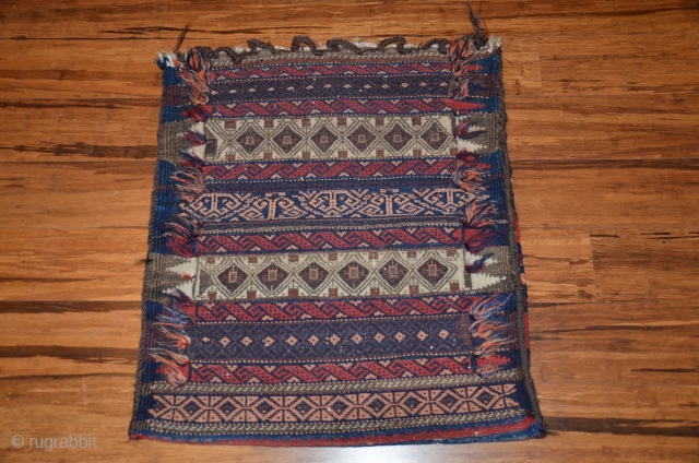 Balouch cuval or 1/2 khorjin. 28” X 26”. Early 20th C. Crafted in intricate weft substitution weave. Complex border finish with floating threads. Plainwoven striped back.  Very good condition.   