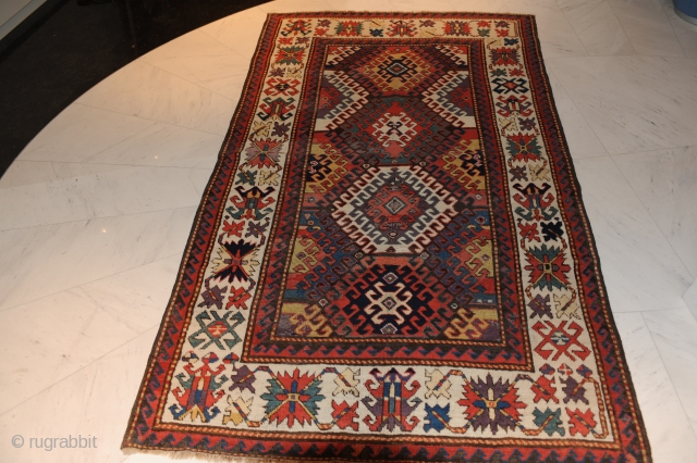 Terrific Kazak – 19th century –

Extremely beautiful and early Kazak carpet with the best possible colours (aubergine, etc.) and a gorgeous iconography! 

approx. 234 x 147 cm

Collector’s item!  Rare!

In good condition!  ...