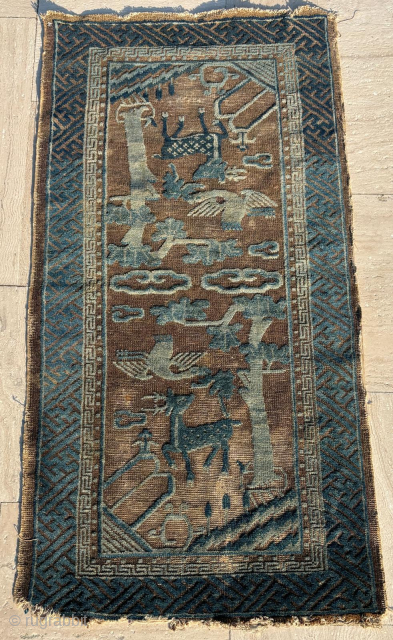 Mid 19th century Chinese rug. Size: 63 x 120 cm