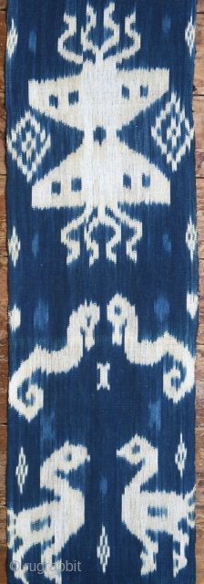 Sumba | indigo ikat men’s headcloth | Indonesia

East Sumba, Kanatang, 2nd half of 20th century

Commercial cotton, natural indigo dye, warp ikat

A headcloth (tiara) woven with large white ikat figures on an indigo  ...