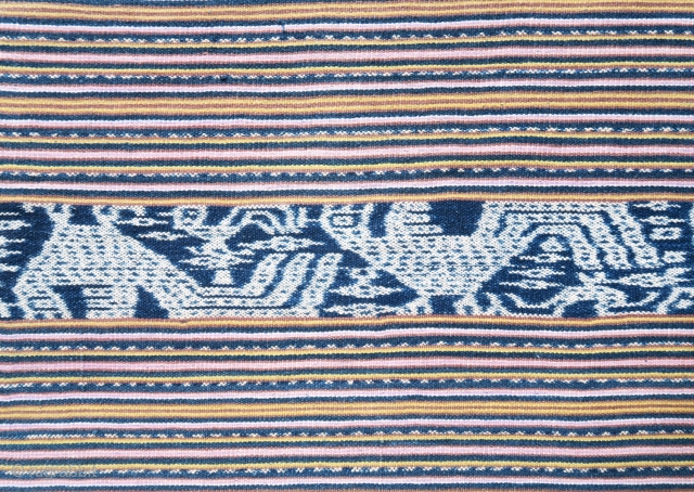 Timor | Men's cloth (beti) with ikat roosters | Indonesia

West Timor, Insana, Manufui, 1950s

Handspun cotton, natural indigo dye, warp ikat, commercial coloured thread (pinstripes), twining 

Description: An elegant vintage men’s cloth (beti)  ...