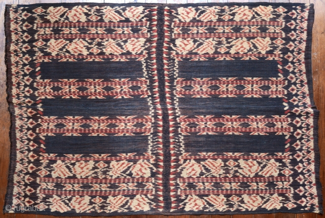 Ikat coffin cover or skirt 

Origin: Roti island, Indonesia, c. 1900 

Technique: Handspun cotton, natural dyes, warp ikat 

Notes: This piece consists of two panels joined together along the selvedge. It was  ...