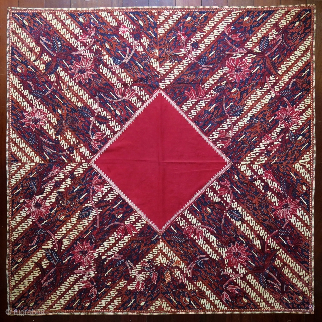 Java | Mid 20th C Hand-Drawn Batik Head Cloth (Iket Kepala)

Indonesia Java, Banyumas, mid 20th century

Commercial cotton and dyes, hand-drawn batik (tulis)

A dramatic ceremonial square that contrasts the cherry red square diamond  ...