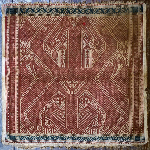 Indonesia | Antique ceremonial weaving tampan
 
Indonesia, Sumatra, Lampung, Komering, Paminggir people, c. 1900
 
Handspun cotton base, supplementary weft weaving, botanical dyes 
 
A large tampan with an imposing design executed in  ...