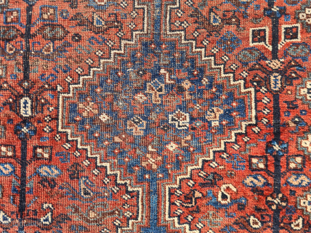 Antique Qashqai Khamseh rug in used condition. The rug has some thin patches (wear) but is still intact. The ends are open. Despite the patina, it is a beautiful bird rug with  ...